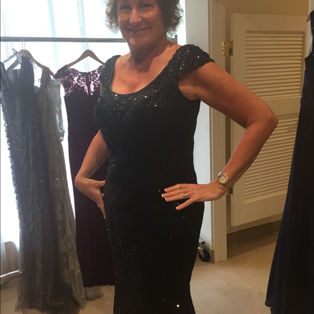 Worn once at my daughter’s wedding, size 10 with no alterations except length